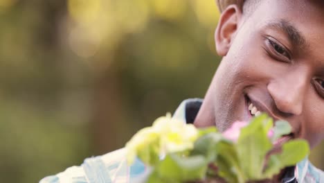 happy gardener holding a plant