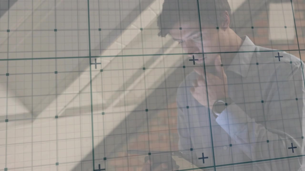 Man tapping tablet screen, initiating animated grid overlay on transparent board and analyzing data