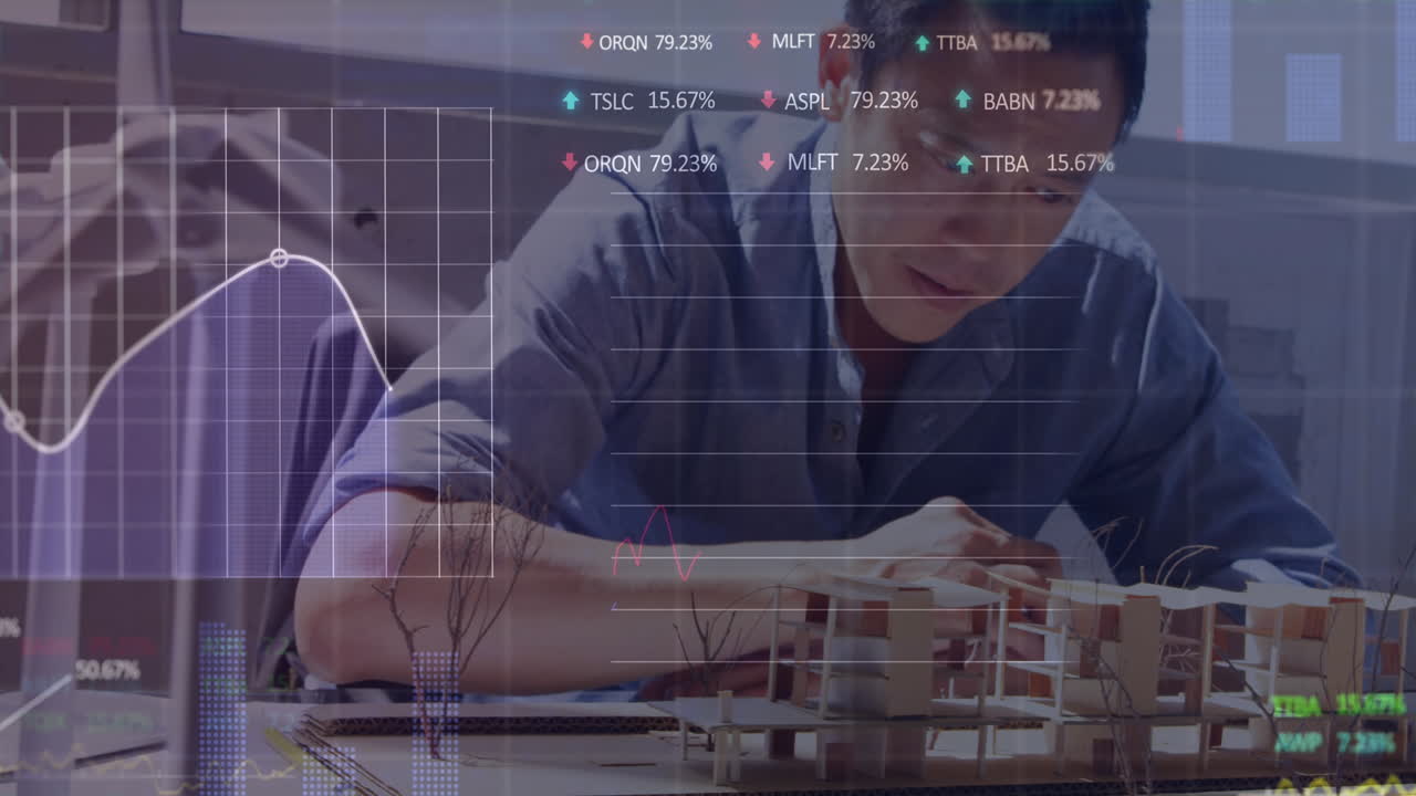 Animation of stock market data processing over asian male architect working on his model at office