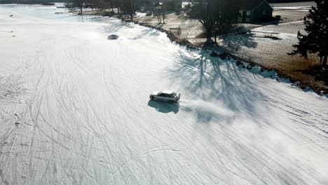 aerial view of bmw drifting on a curbe at the iced track from poynette wisconsin