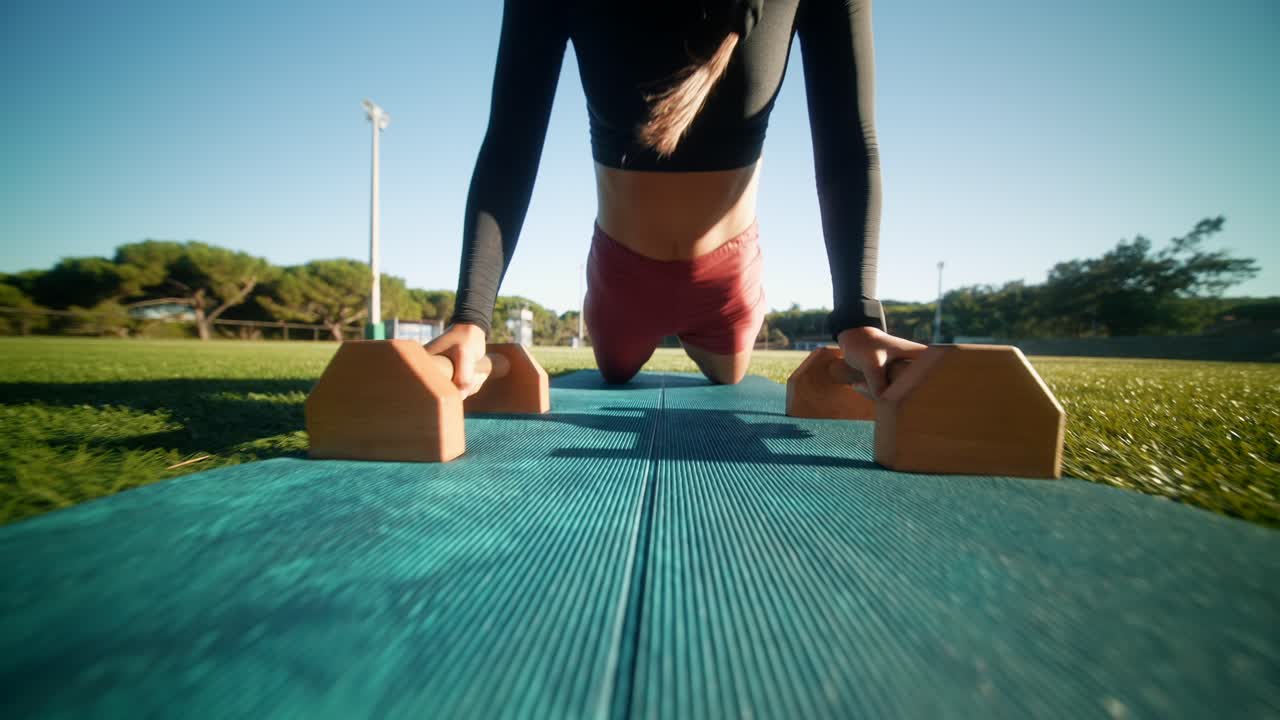 Woman Doing Push-Ups on Exercise Mat Outdoors