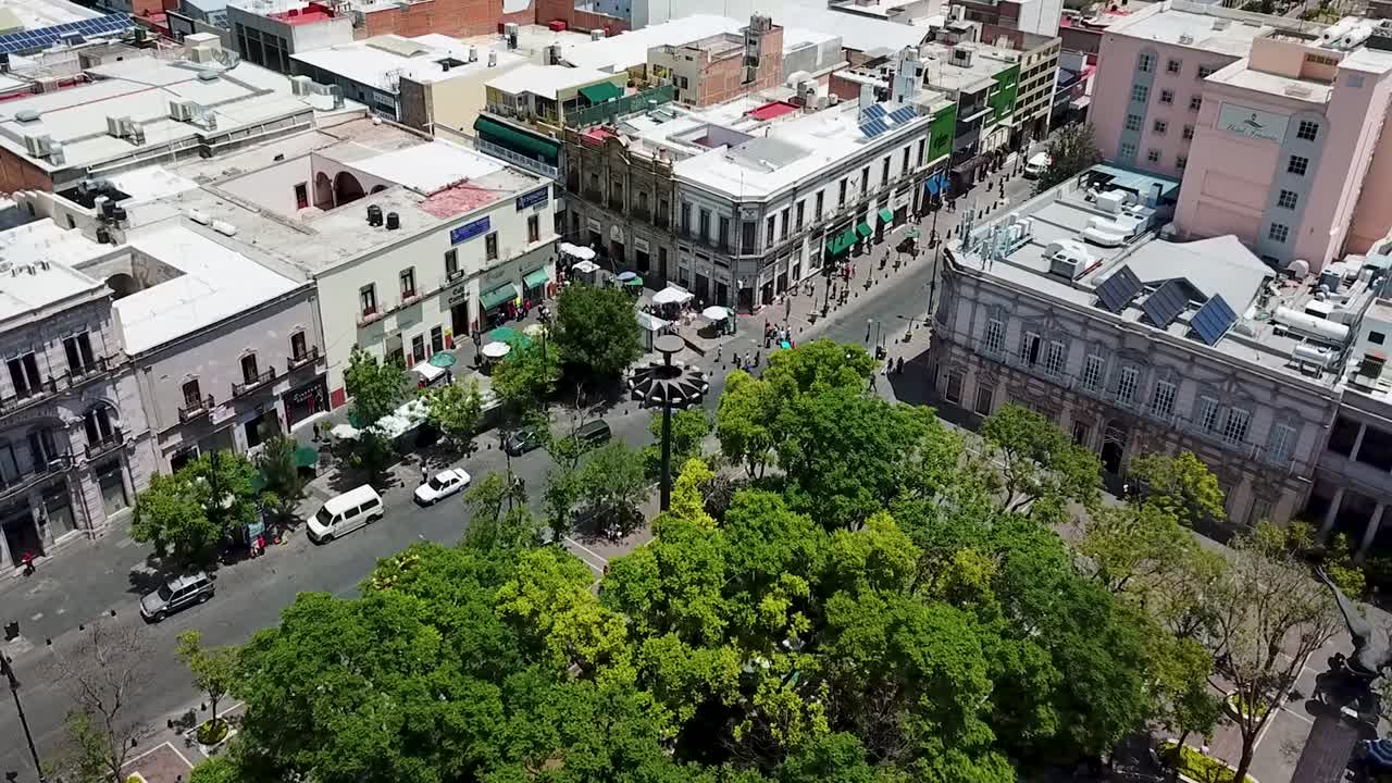 Orbital aerial shot of the historic buildings in the central square of Aguascalientes City, Mexico