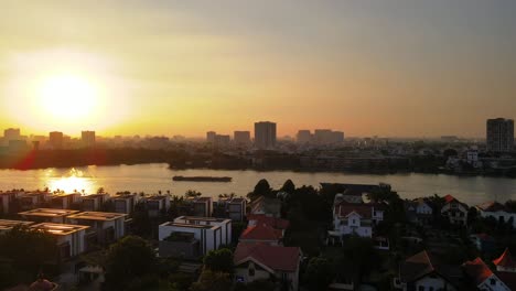 aerial drone in 4k over ho chi minh city, saigon river, vietnam