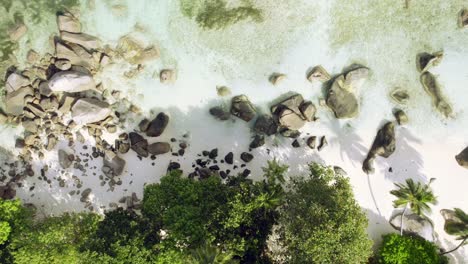 Mahe-Seychelles,-Drone-sideway-shot-of-the-beach-near-Beau-Vallon