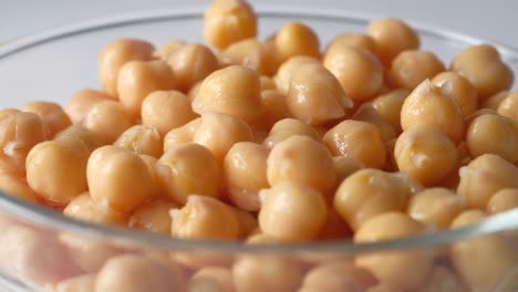 close-up of cooked chickpeas in a glass bowl