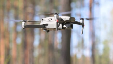 Drone-copter-flying-with-digital-camera-in-forest