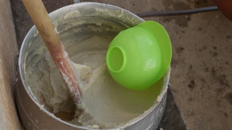 Ready-mix-of-banku-in-a-pot,-national-dish-of-ghana,-packed-by-Ghanaian-woman,-ready-to-consume