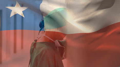 digital composition of chile flag waving against stressed caucasian female surgeon at hospital