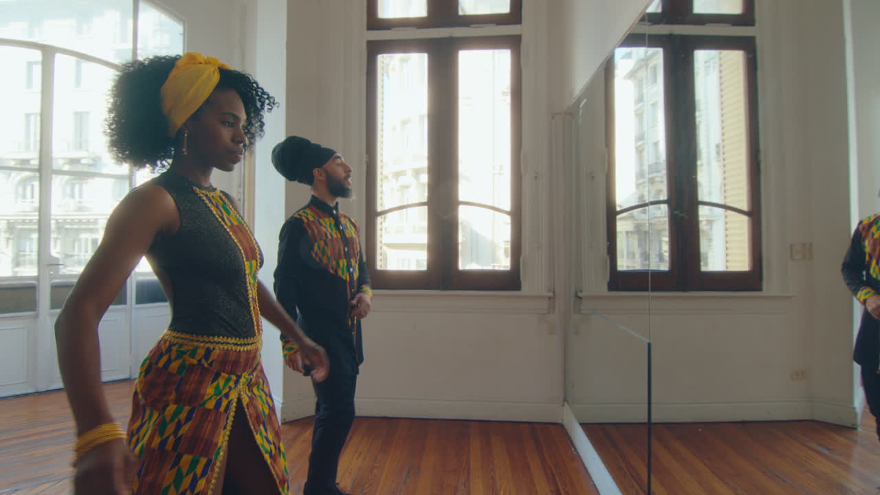 Talented Couple of Professional Dancer Practicing Tango Movements in Studio