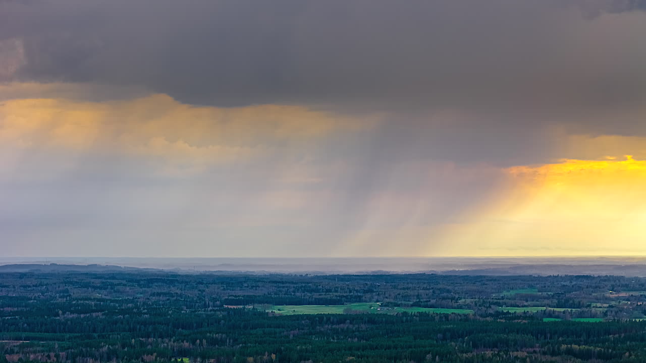 Dark Clouds Moving Against Sunset Horizon In Rural Nature. Timelapse