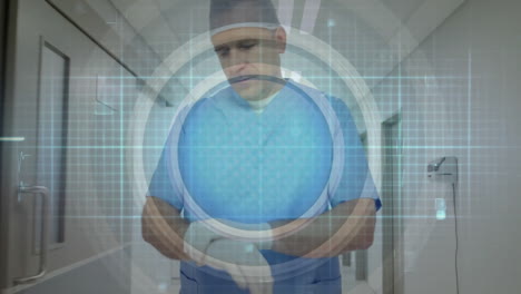 Animation-of-cardiograph-and-shapes-over-caucasian-male-doctor-walking-in-hospital