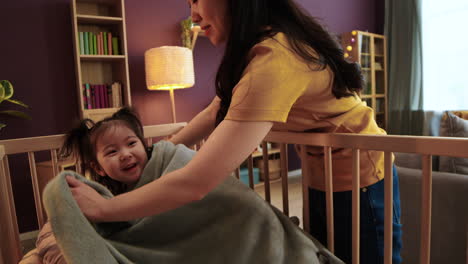 asian baby in a crib