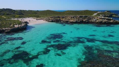 Aerial-view-above-the-sea,-in-the-coast-of-Rottnest-Island,-Australia--orbit,-drone-shot