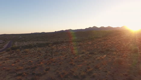 Panning-drone-shot-of-desert-sunset-with-mountains-in-the-background-located-in-Flagstaff-Arizona