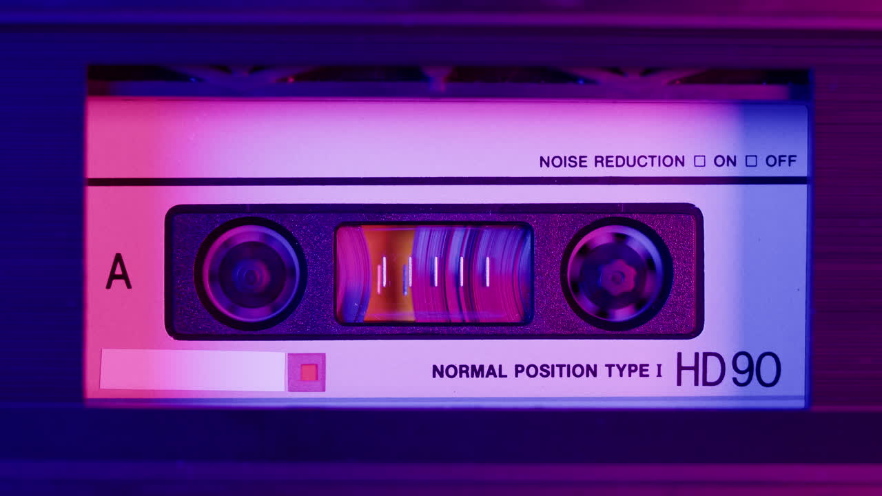 Close-up of a Vintage Audio Cassette with Neon Lighting