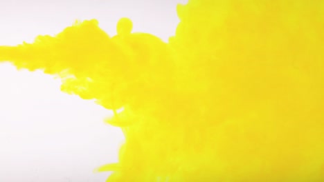 yellow color paint drops in water , drop of yellow ink color falling on water colorful ink , 4k footage,