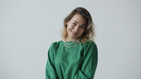 woman in green polka dot dress