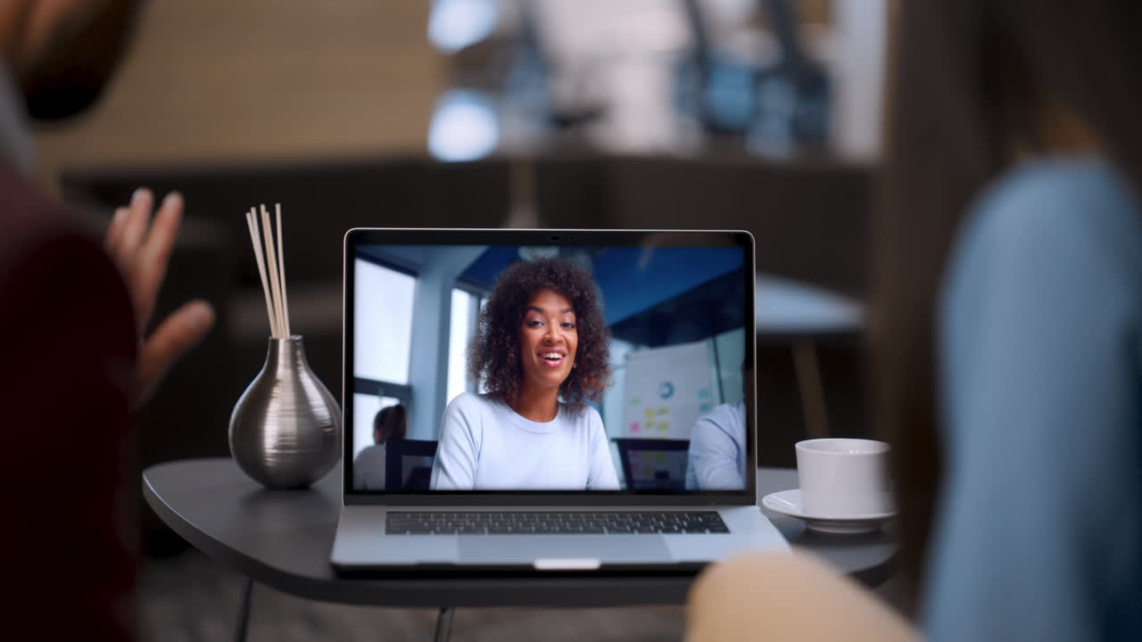 Coworkers communicating webcam conference by laptop close up. Couple video call