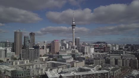 drone rising showing cbd auckland and skycity on a sunny day