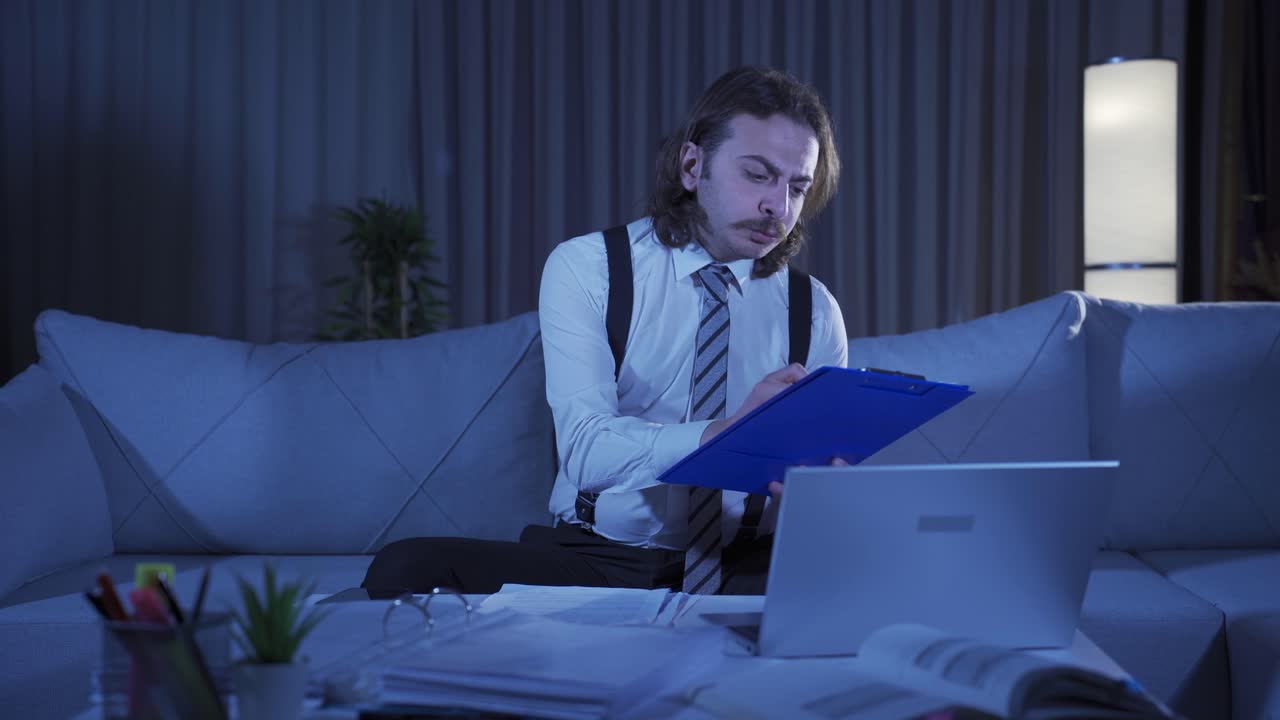 Serious and focused working man gets angry at what he sees on the screen.