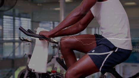 animation of data processing over african american man exercising in gym