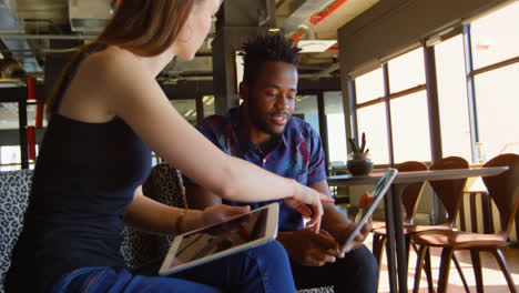 Side-view-of-young-cool-mixed-race-business-team-planning-and-sitting-on-couch-of-modern-office-4k