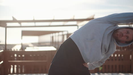 man stretching outdoors