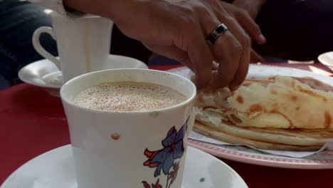 enjoying a cup of chai with paratha