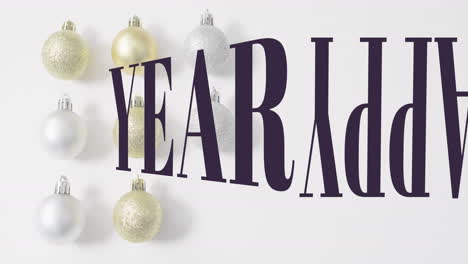 animation of merry christmas text banner against decorative baubles on white surface