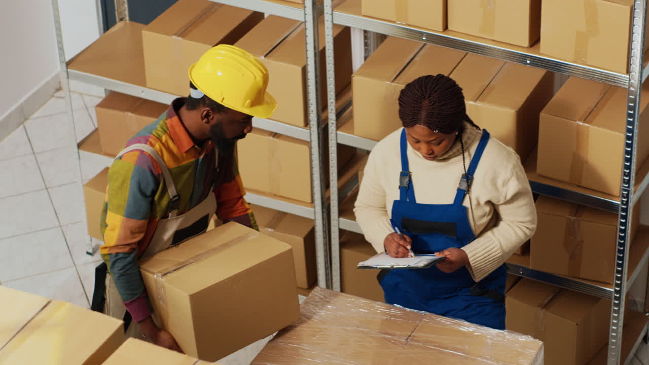 Workers moving boxes in a warehouse