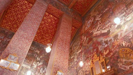 a detailed view of ornate murals and architecture inside wat pho, bangkok, showcasing vibrant colors and intricate designs