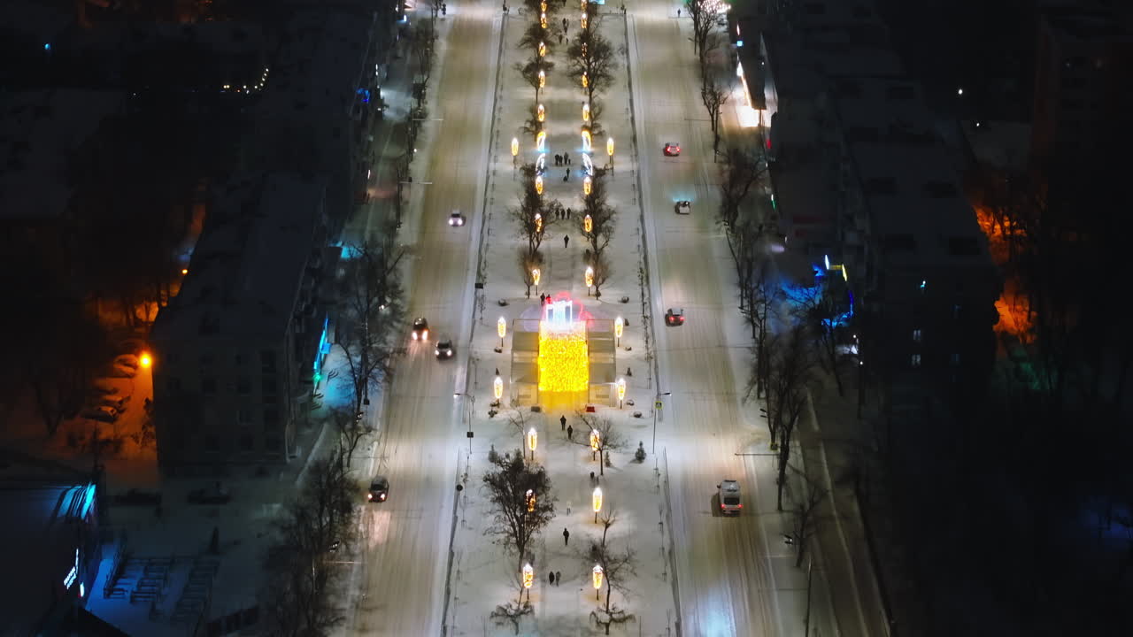Aerial drone view of Chisinau city covered in snow at night, blue hour. Moldova
