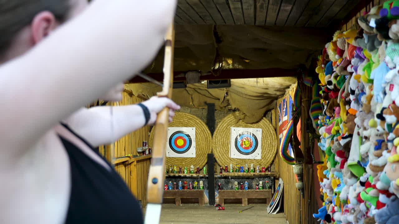 Bulgaria, VARNA, Golden Sand Resort - 20 AUGUST 2018 - Woman with an arch hitting the targets