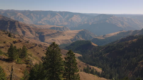 aerial overlooking hazy hells canyon river gorge from oregon