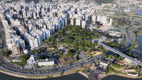 aerial drone scene at high altitude of the center of florianópolis urban center big capital with many buildings streets and hercilio luz bridge, urban center seen from above capital santa catarina