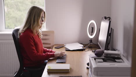 woman working at her desk in home office