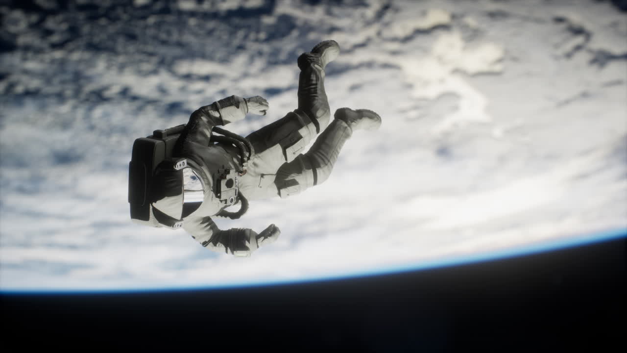 Astronaut floating above the Earth Elements of this image furnished by NASA