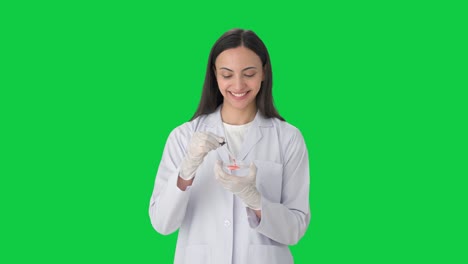 Happy-Indian-female-scientist-doing-experiments-Green-screen