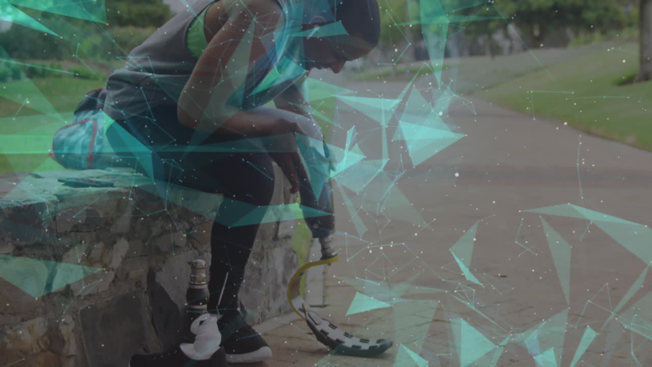 Animation of floating network over male athlete preparing running blade for exercise outdoors