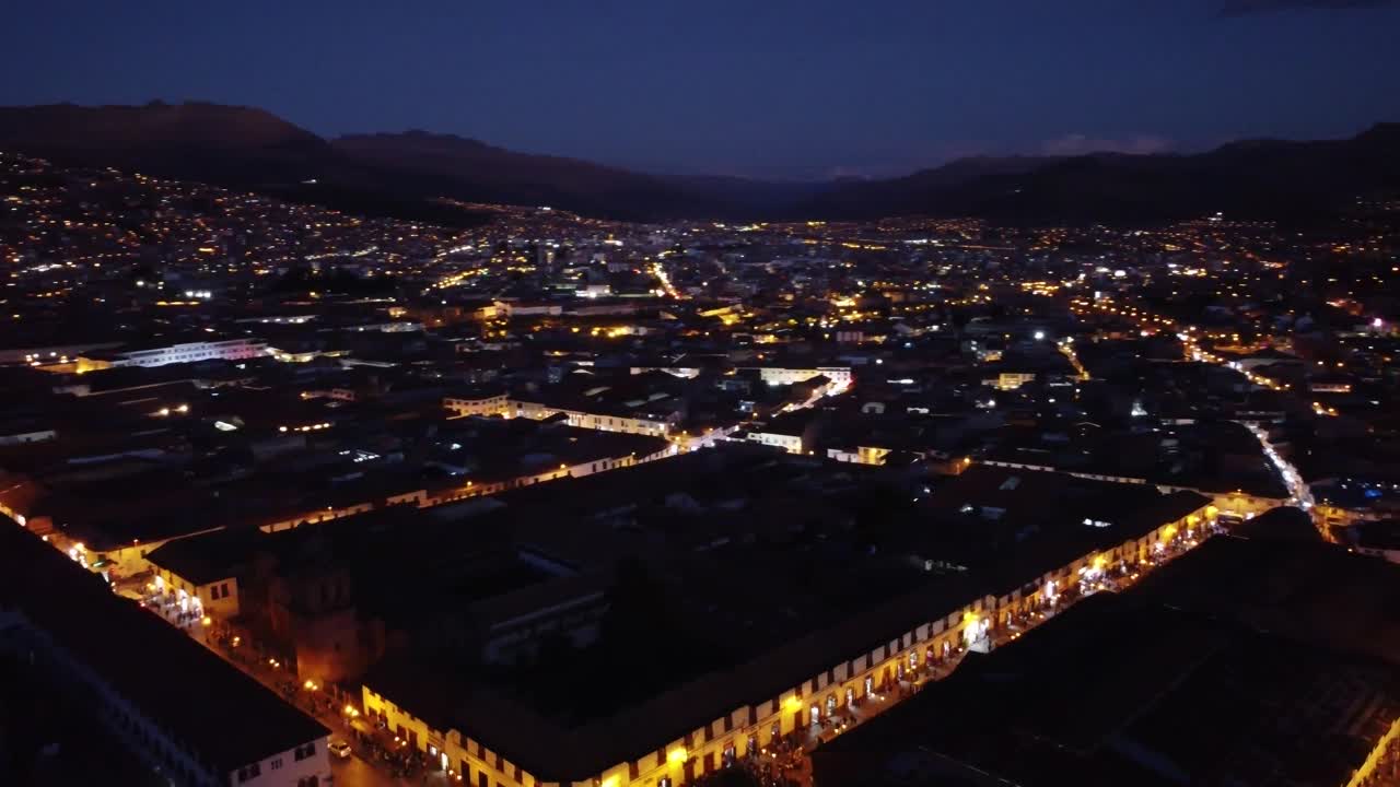 Bright Lights At The City Of Cusco During Nighttime In Peru. aerial