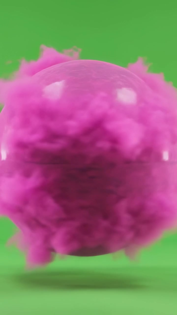 Video verticale: Sfera rosa pelosa animata che fluttua, ondeggia e ruota su uno sfondo verde, mostrando il nucleo.