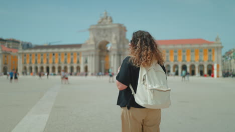 tourist in lisbon's praca do comercio