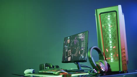 video of gaming computer and gaming equipment on desk with copy space on neon background