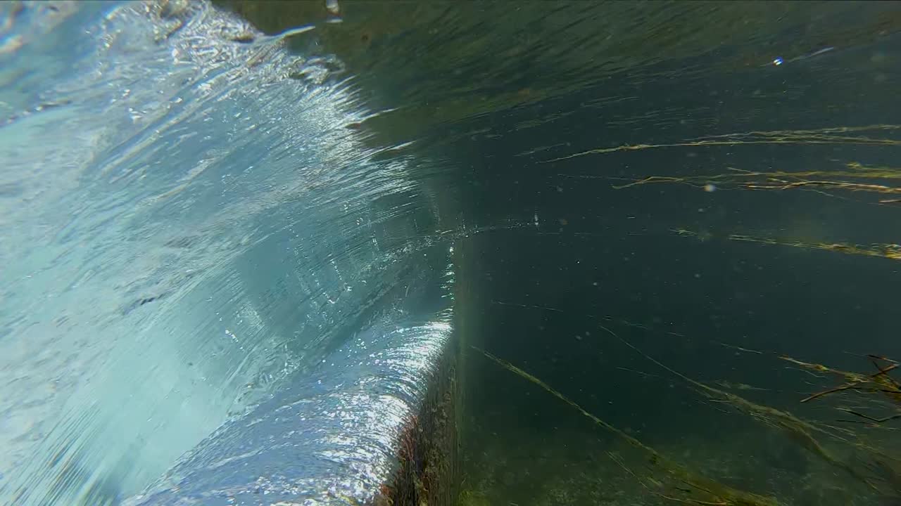 Waterfall series shot on an unusual spring fed canal in western Texas. Series contains several slow motion scenes of a small waterfall including spectacular underwater footage with aquatic wildlife