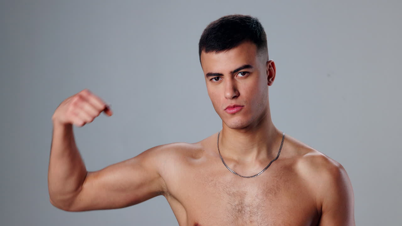 Shirtless man flexing his muscles