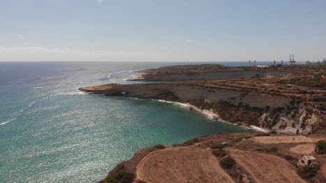 Aerial-drone-video-from-eastern-Malta,-Marsaxlokk-area,-Il-Hofra-l-Kbira-bay