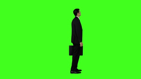 Businessman-standing-with-his-briefcase