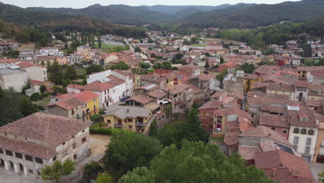 establishing aerial drone shot of a small spanish village in the mountains