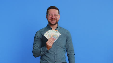 rich happy man winner waving money euro cash like a fan big income wealth success business