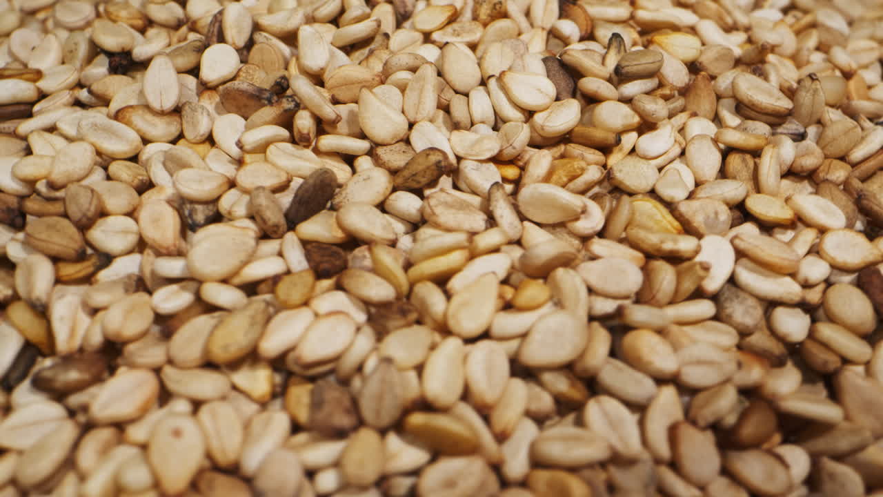 White dried sesame seeds rotating close-up macro. Super food. Sprinkles for food.Healthy concept. .Healthy concept. High quality 4k footage